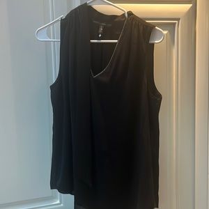 Black sleeveless dressy bliss with gold trim around neck and neck tie
